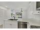 Bright kitchen area with white cabinets, stone countertops and stainless steel appliances at 4131 Oakhurst W Cir # 3133, Sarasota, FL 34233