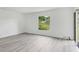 Bright, open living room features durable floors and large window overlooking backyard at 4131 Oakhurst W Cir # 3133, Sarasota, FL 34233
