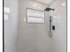 Bright walk-in shower features sleek fixtures, a modern rain shower head, and white marble tile at 4131 Oakhurst W Cir # 3133, Sarasota, FL 34233