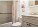 Bathroom featuring a shower-tub combination, vanity, and decorative accents at 4165 66Th Street W Cir # H, Bradenton, FL 34209