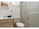 Clean bathroom with a shower, toilet, and vanity, providing essential functionality in a compact space at 4165 66Th Street W Cir # H, Bradenton, FL 34209