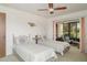 Cozy bedroom featuring twin beds, neutral colors, and access to a screened patio at 4165 66Th Street W Cir # H, Bradenton, FL 34209
