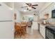Open-concept living space flows seamlessly into a kitchen and dining area, enhancing the home's appeal at 4165 66Th Street W Cir # H, Bradenton, FL 34209