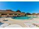 Inviting community pool with clear blue water, surrounded by lounge seating and well-maintained facilities at 4165 66Th Street W Cir # H, Bradenton, FL 34209