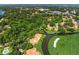 Breathtaking aerial view of the golf course, waterways, mature trees and tile roofs at 4637 Willow Wood Cir # 44, Sarasota, FL 34241