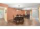 Dining room features hardwood floors, a modern light fixture, and seating for six at 4637 Willow Wood Cir # 44, Sarasota, FL 34241