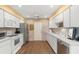 Functional kitchen with white appliances, wood floors and neutral walls at 4637 Willow Wood Cir # 44, Sarasota, FL 34241