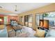 Inviting living room with views to dining and courtyard, tile flooring, neutral paint scheme and comfortable seating at 4637 Willow Wood Cir # 44, Sarasota, FL 34241