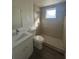 Tiled bathroom with a shower, new vanity, and modern fixtures at 4740 Garcia Ave, Sarasota, FL 34233