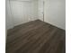Spacious bedroom boasts wood-look floors and closet space at 4740 Garcia Ave, Sarasota, FL 34233