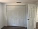 Bright bedroom has a closet and a door to the hallway at 4740 Garcia Ave, Sarasota, FL 34233