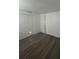 Inviting bedroom features wood-look floors and ample closet space at 4740 Garcia Ave, Sarasota, FL 34233
