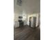 Updated kitchen features stainless steel appliances, white cabinets, and modern countertops at 4740 Garcia Ave, Sarasota, FL 34233