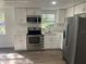 Renovated kitchen offers stainless steel appliances and ample natural light at 4740 Garcia Ave, Sarasota, FL 34233