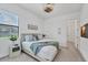 Comfortable bedroom with a queen bed, soft blue accents, and a peaceful ambiance at 4925 Coastal Days Ln, Bradenton, FL 34211