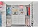 Spacious walk-in closet with custom shelving and ample storage for clothes and accessories at 4925 Coastal Days Ln, Bradenton, FL 34211