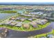 Gorgeous aerial view of home overlooking the water with private backyard and lush landscaping at 4925 Coastal Days Ln, Lakewood Ranch, FL 34211