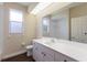 Spacious bathroom featuring a large vanity, updated fixtures, and natural light at 4998 Cedar Oak Way, Sarasota, FL 34233