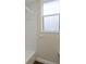 A well-lit bathroom features a window, a bath tub, and a shower at 4998 Cedar Oak Way, Sarasota, FL 34233