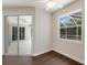 Bright bedroom featuring laminate flooring and a sliding glass door leading to lanai at 4998 Cedar Oak Way, Sarasota, FL 34233