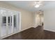 Bedroom with laminate floors, plantation shutters, and ample closet space at 4998 Cedar Oak Way, Sarasota, FL 34233