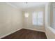 Classic dining room area with wood floors and a view out the window at 4998 Cedar Oak Way, Sarasota, FL 34233
