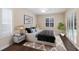 Staged main bedroom with plantation shutters, ceiling fan, and a view of the pool at 4998 Cedar Oak Way, Sarasota, FL 34233