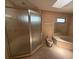 Bathroom with a walk-in shower, bidet, and a corner soaking tub at 5032 81St Avenue E Ter, Sarasota, FL 34243