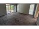Large bedroom features cozy carpeting, bright windows, and ample space for relaxation and rest at 5032 81St Avenue E Ter, Sarasota, FL 34243