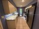 Bright kitchen features granite countertops, stainless steel appliances, and ample cabinet space at 5032 81St Avenue E Ter, Sarasota, FL 34243