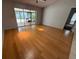 Bright living room with bamboo floors and sliding glass doors to outdoor space at 5032 81St Avenue E Ter, Sarasota, FL 34243