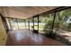 Spacious screened porch with tiled floor and views of the backyard at 5032 81St Avenue E Ter, Sarasota, FL 34243