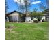 Spacious backyard with a screen porch, ideal for entertaining guests or relaxing outdoors at 5213 20Th Street E Ct, Bradenton, FL 34203
