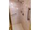 Bathroom shower with tile surround and accessibility grab bars at 5213 20Th Street E Ct, Bradenton, FL 34203