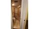 Bathroom featuring a toilet, shower with glass doors, and tiled floors at 5213 20Th Street E Ct, Bradenton, FL 34203