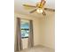 Bedroom featuring a ceiling fan and window at 5213 20Th Street E Ct, Bradenton, FL 34203