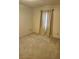 Bedroom with neutral-toned walls and carpet, bathed in soft natural light at 5213 20Th Street E Ct, Bradenton, FL 34203