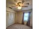 Bedroom with a ceiling fan and light, and a closet with sliding doors at 5213 20Th Street E Ct, Bradenton, FL 34203