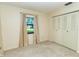 Bright bedroom featuring a window with a view and a large closet at 5213 20Th Street E Ct, Bradenton, FL 34203