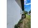 Exterior side view showcasing the property's stucco siding and landscaping at 5213 20Th Street E Ct, Bradenton, FL 34203