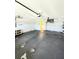 Spacious two-car garage with painted walls, storage, and an automatic door opener at 5213 20Th Street E Ct, Bradenton, FL 34203