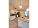 Well-lit kitchen with stainless steel appliances, white cabinets, and a sink with a view at 5213 20Th Street E Ct, Bradenton, FL 34203