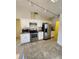 Updated kitchen with stainless steel appliances and ample white cabinetry at 5213 20Th Street E Ct, Bradenton, FL 34203