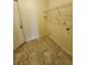 Laundry room featuring wire shelving and flooring at 5213 20Th Street E Ct, Bradenton, FL 34203