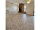 Open-concept living room with a stone fireplace, tile floors, and plenty of natural light at 5213 20Th Street E Ct, Bradenton, FL 34203