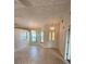Inviting living room with tile flooring and natural light from the multiple windows at 5213 20Th Street E Ct, Bradenton, FL 34203