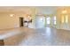 Bright living space with tile floors, open to the kitchen and dining area with natural light at 5213 20Th Street E Ct, Bradenton, FL 34203