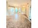 Bright living room featuring large windows allowing natural light and neutral-colored tile flooring at 5213 20Th Street E Ct, Bradenton, FL 34203