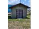 Outdoor shed with large doors for lawn equipment and other outdoor storage at 5213 20Th Street E Ct, Bradenton, FL 34203