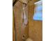 Close-up of a shower featuring tile surround, a shower head, and a faucet at 5213 20Th Street E Ct, Bradenton, FL 34203
